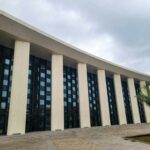 A large building with a lot of windows on it